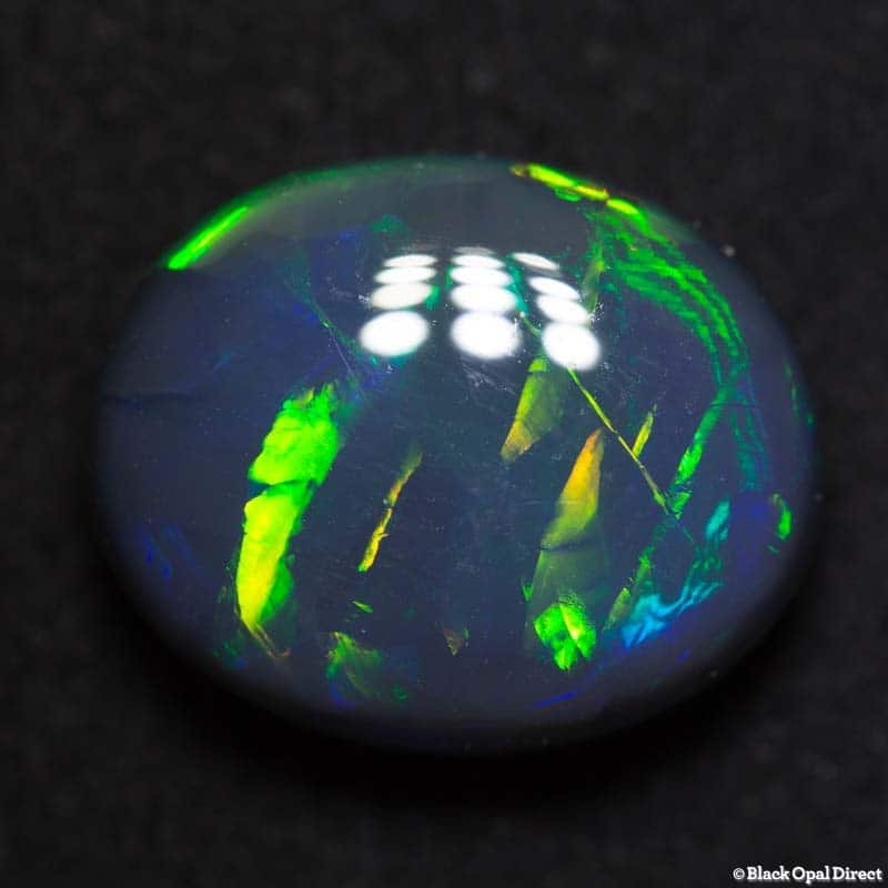 8.79 ct black opal gem with Chinese writing 15x12x7mm