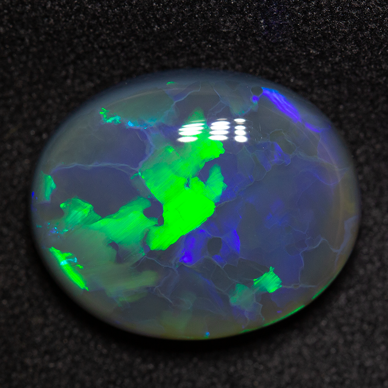 9.32 ct black opal 16.6x13.4x6.4mm
